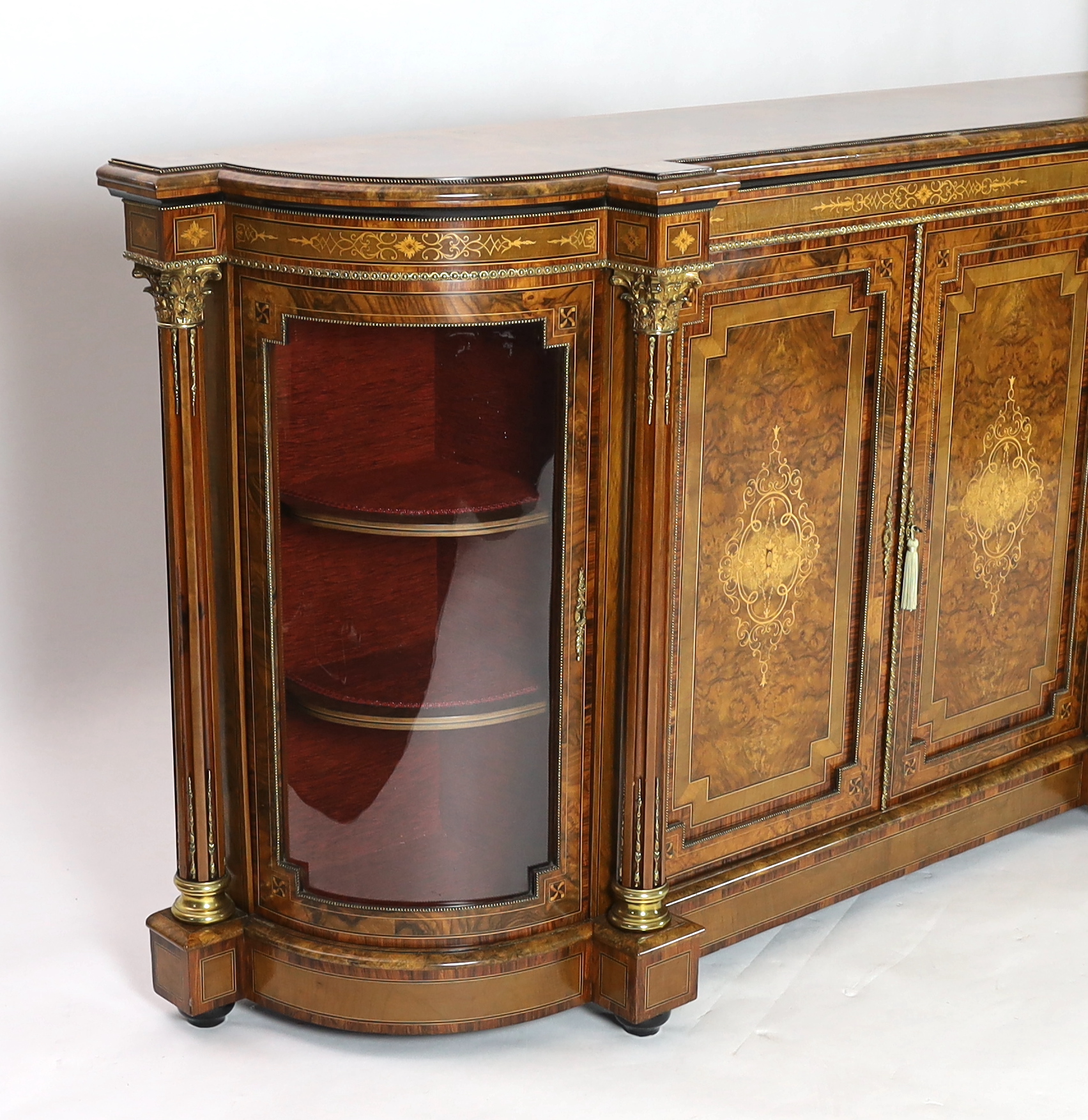 A Victorian marquetry inlaid figured walnut credenza 194cm wide, 49cm deep, 108cm high